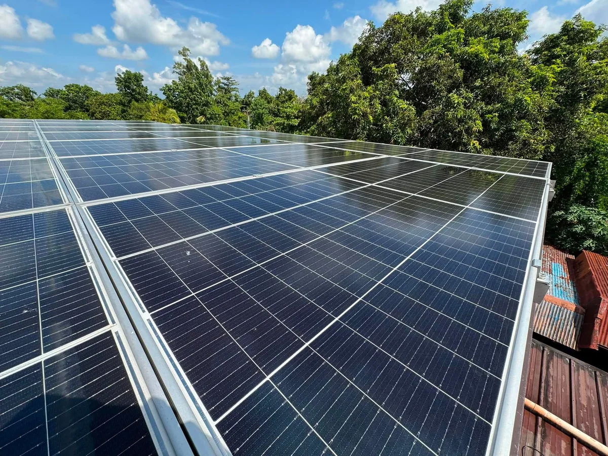 The same rooftop solar array freshly cleaned, with crisp, reflective glass.